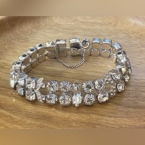 Beautiful bracelet, silver colored with chain.